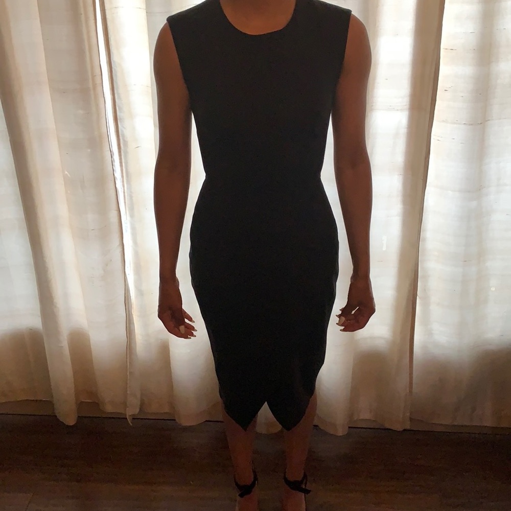 Black dress, form fitting.